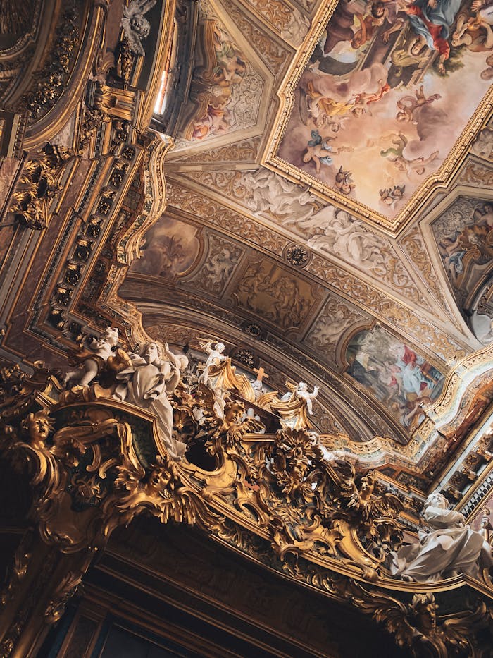 pexels photo 29893936 Intricate baroque architecture of a Roman basilica ceiling, rich with historic art and sculptures.